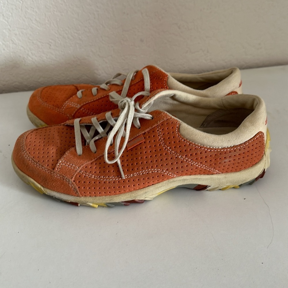 Woman’s size 9, Simple brand, orange walking shoes. Hardly used in good shape.
